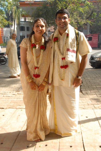 The author and her husband in tradition wedding attire