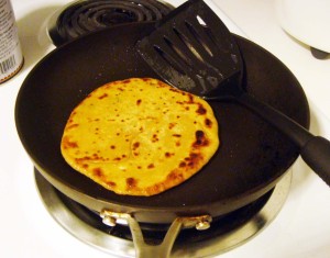 Cook the paratha till it is golden-brown on each side